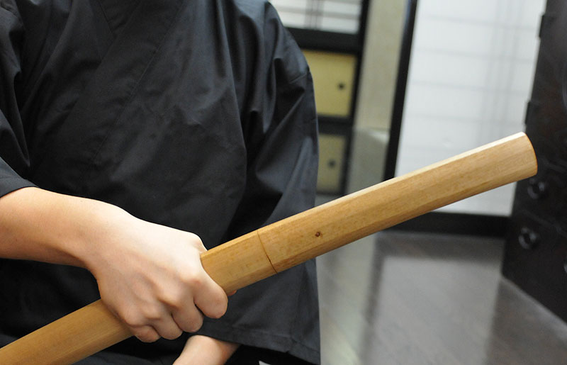 image of holding Japanese sword in right hand