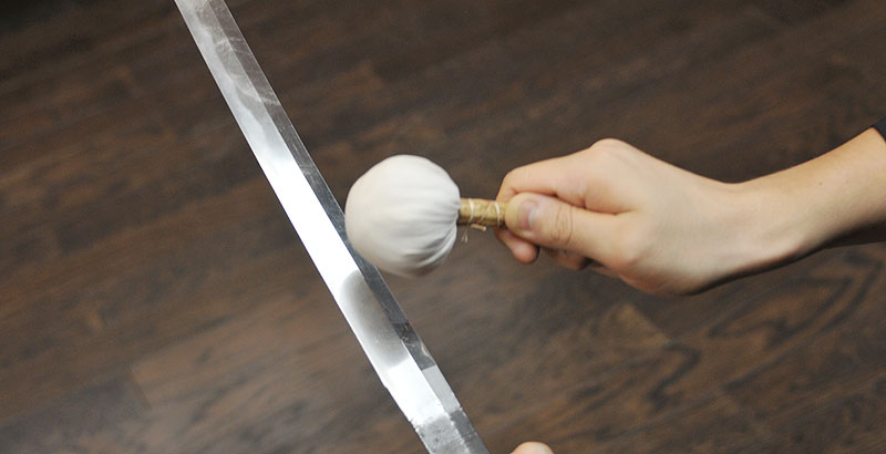 Applying Uchiko powder on the Japanese sword blade surface