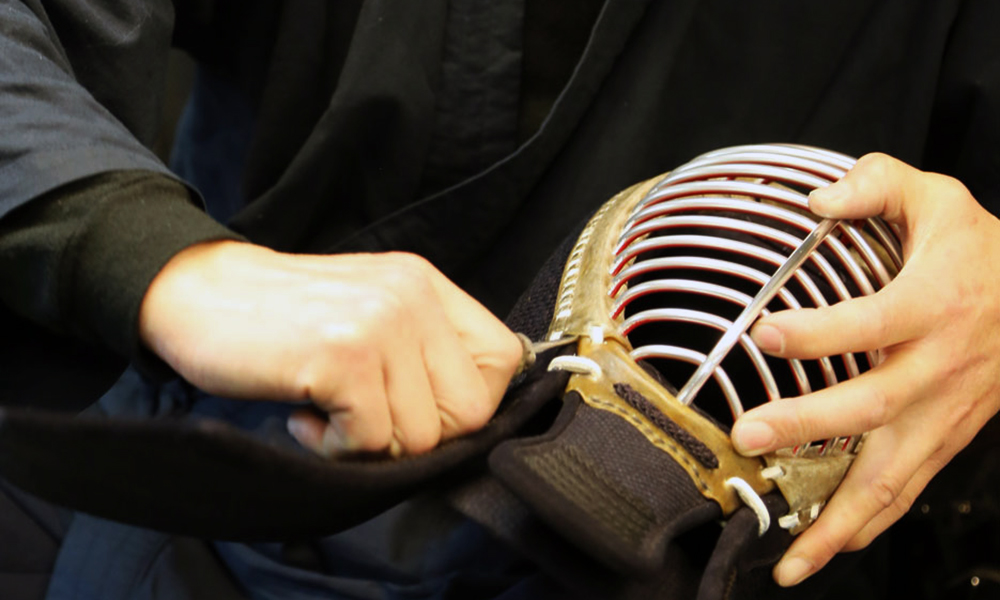 An image of Tozando Kendo craftsman assembling Men mask