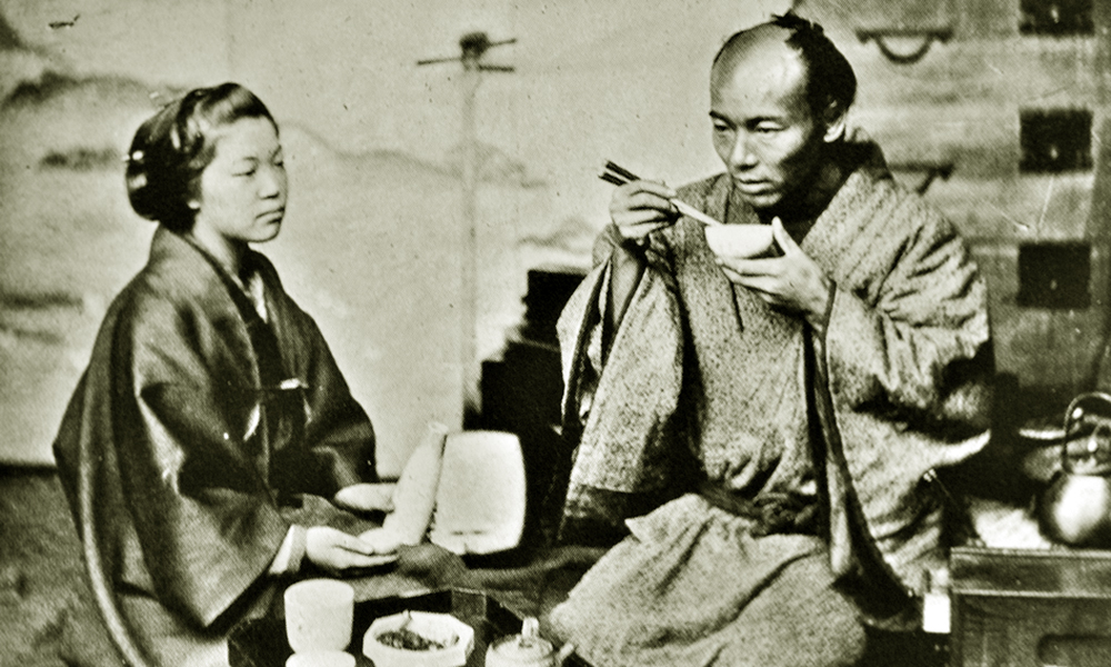 A Samurai eating Miso soup at dinner