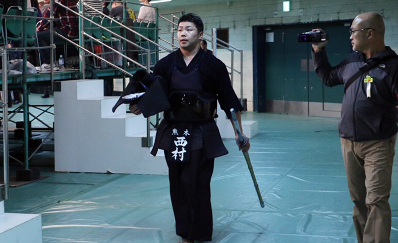 Nishimura walking to the arena