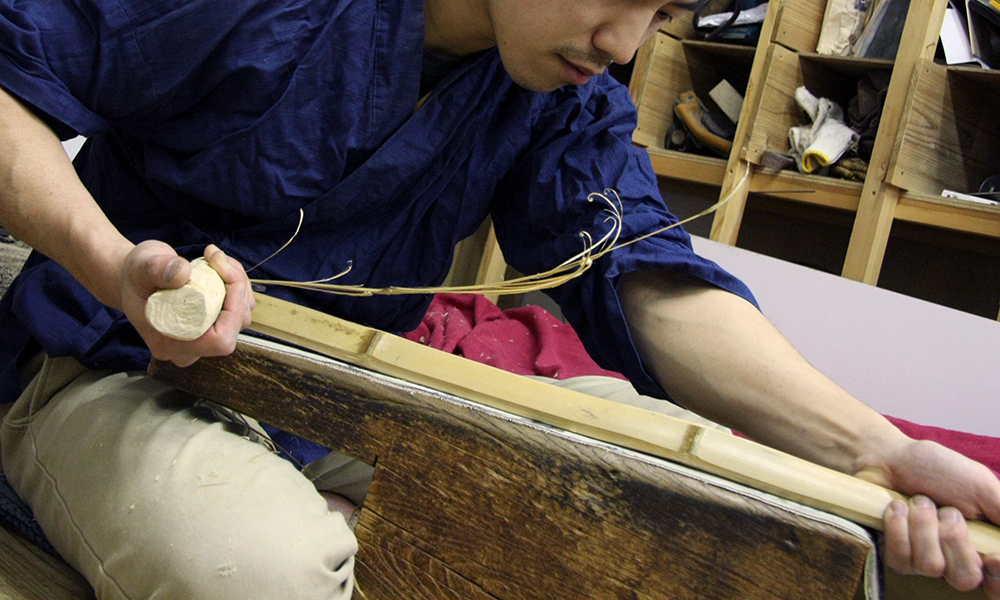 Shinai craftsman shaving the bamboo stave to make Kendo Shinai