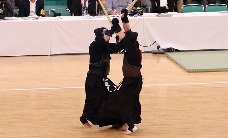 Katsumi sword-battling against his opponent at the 66th All Japan Kendo Championship Taikai