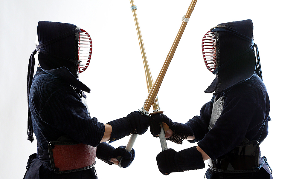 Two Kendo players facing each other